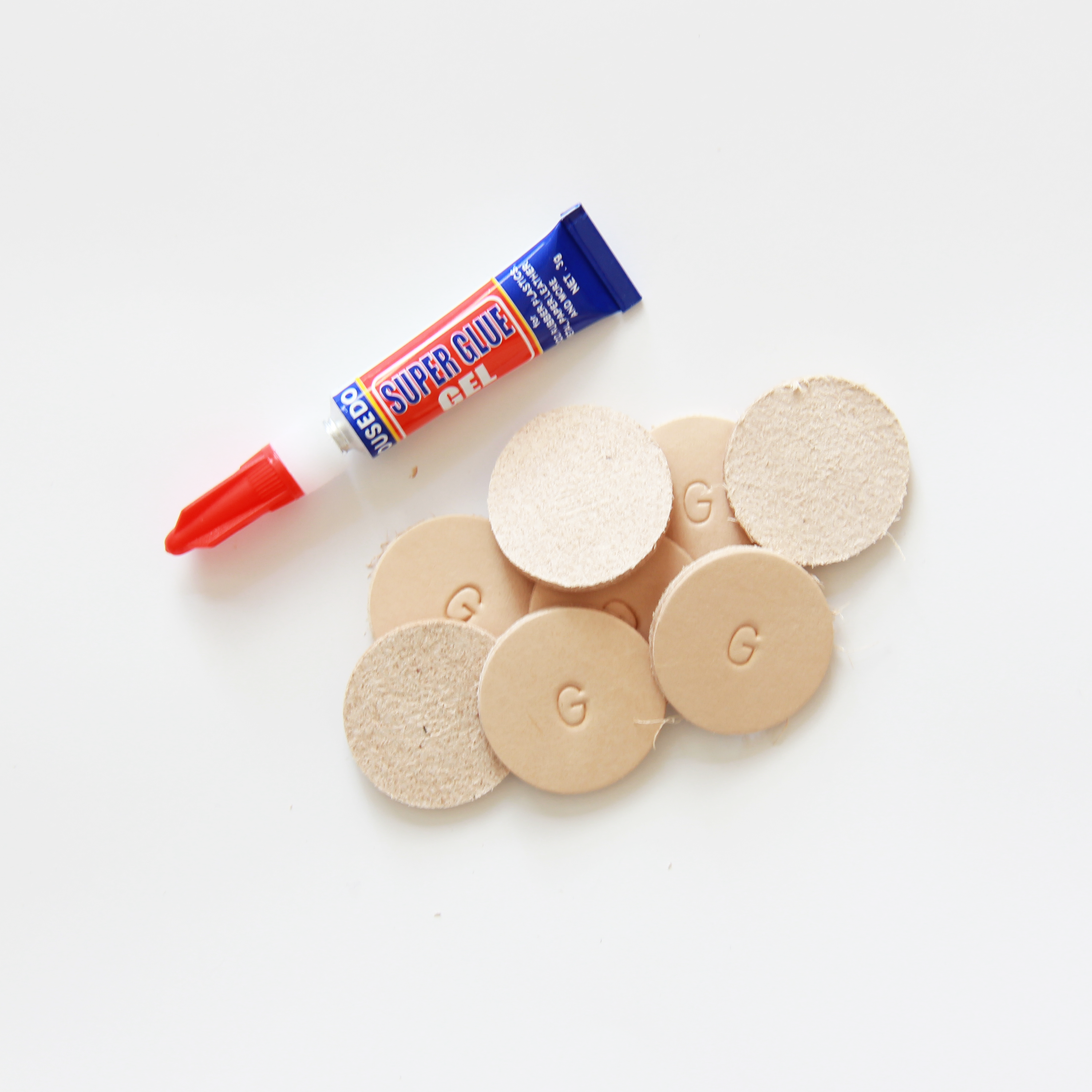 Glue-On Leather Floor Protectors for Heavy Furniture - 1.25" Round USA-Made Vegetable Tanned Pads (8-Pack)